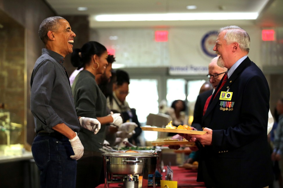 U.S. President Barack Obama and First Lady Michelle Obama serve Thanksgiving dinner to residents of AFRH in Washington