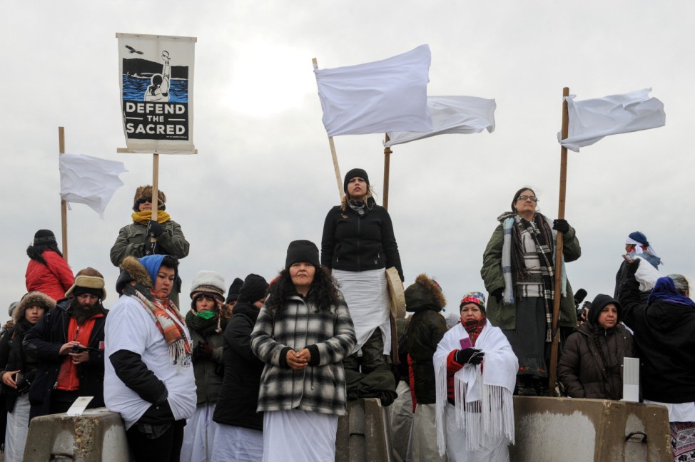 Women hold a demonstration on Backwater Bridge during a protest against plans to pass the Dakota Access pipeline near the Standing Rock Indian Reservation, near Cannon Ball, North Dakota, U.S.
