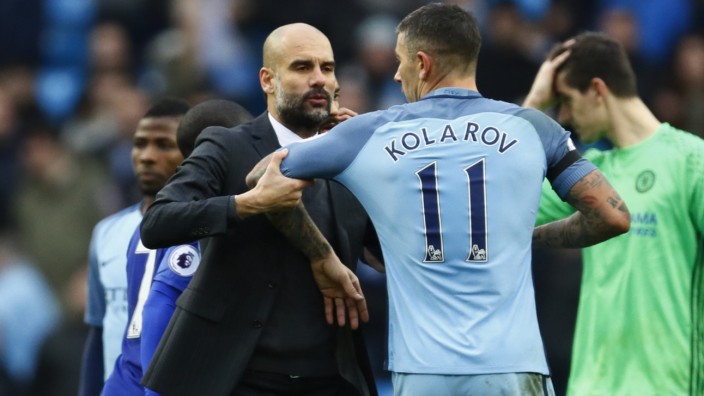 Manchester City's Aleksandar Kolarov with manager Pep Guardiola at the end of the match