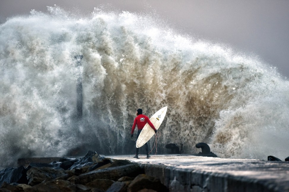 A Pro-surfer Waits For A Break In The Surge