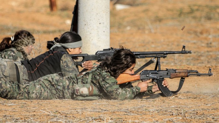 Female fighters of the Kurdish People's Protection Units participate in a military training in the western countryside of Ras al-Ain
