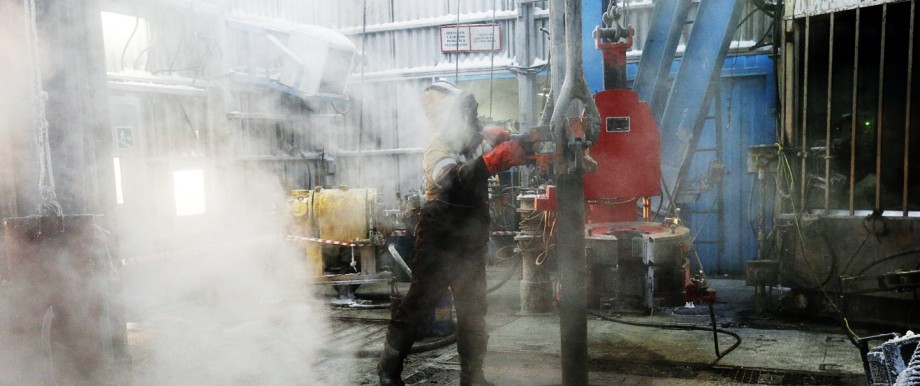 File photo of employee working on drilling rig at Lukoil-owned Imilorskoye oil field outside Kogalym