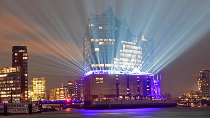 The 'Elbphilharmonie' is illuminated during a light test in downtown Hamburg