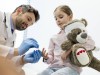 Doctor treating girl holding teddy model released Symbolfoto property released PUBLICATIONxINxGERxSU