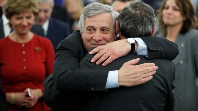 Newly elected European Parliament President Tajani is congratulated by members of the Parliament as he arrives for the announcement of the results of the election at the European Parliament in Strasbourg