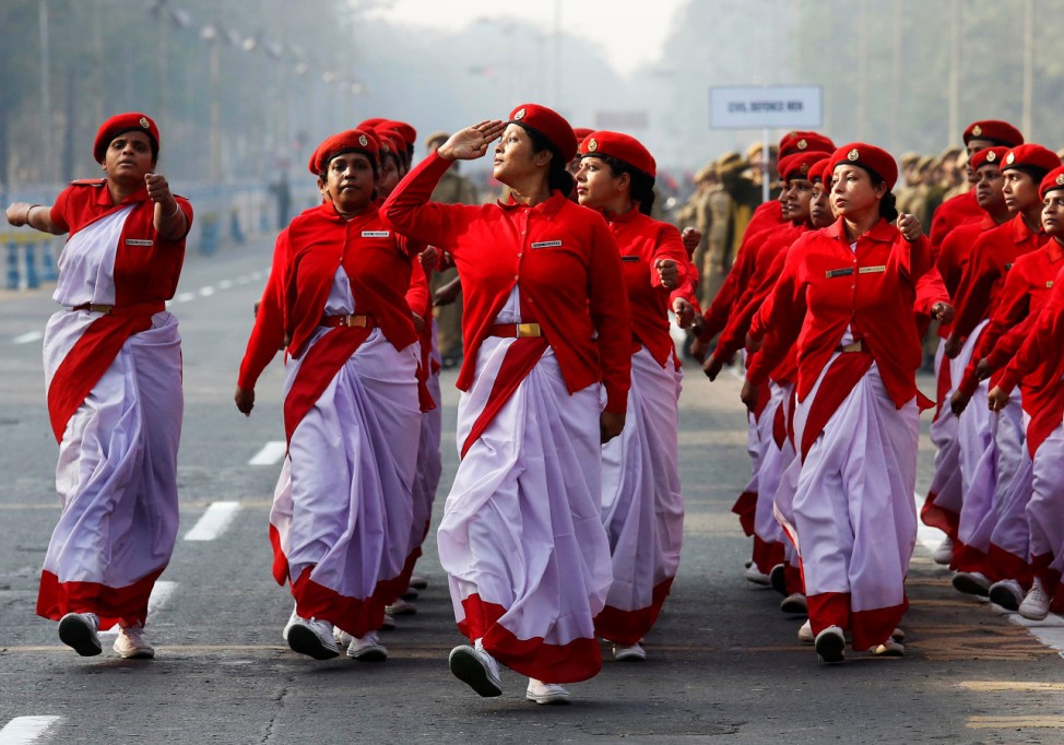 Indian civil defence personnel march during a full-dress rehearsal for India's Republic Day parade in Kolkata