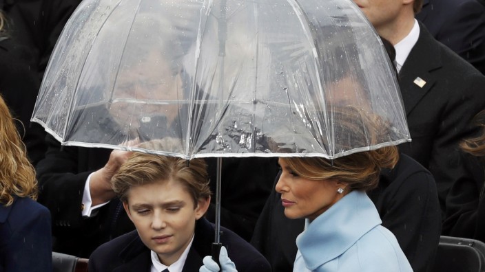 Melania and Barron Trump shield under an umbrella during the inauguration ceremonies to swear in Donald Trump as the 45th president of the United States at U.S. Capitol in Washington