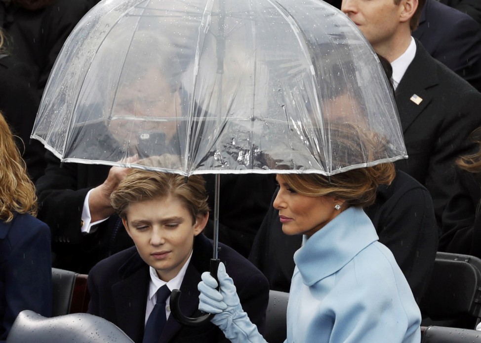 Melania and Barron Trump shield under an umbrella during the inauguration ceremonies to swear in Donald Trump as the 45th president of the United States at U.S. Capitol in Washington