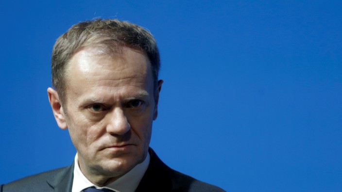 President of the European Council Tusk listens during a news conference in Tallinn