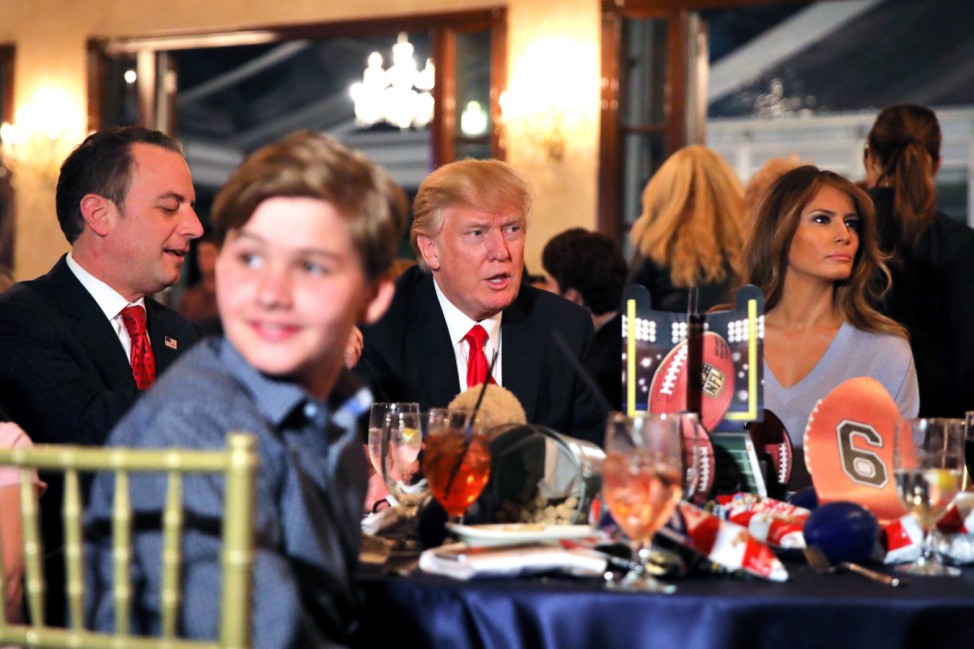 U.S. President Donald Trump and First Lady Melania watch the Super Bowl LI between New England Patriots and Atlanta Falcons, accompanied by White House Chief of Staff Reince Priebus at Trump International Golf club in West Palm Beach, Florida, U.S.