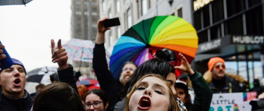 People participate in a kiss-in protest against U.S. President Donald Trump organized by the LGBT community near Trump Tower in New York City