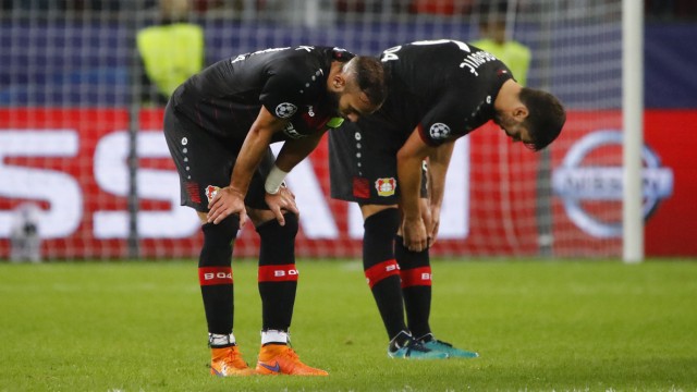 Bayer Leverkusen's Aleksander Dragovic and Omer Toprak look dejected after the match