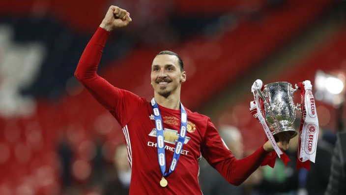 Manchester United's Zlatan Ibrahimovic celebrates with the trophy