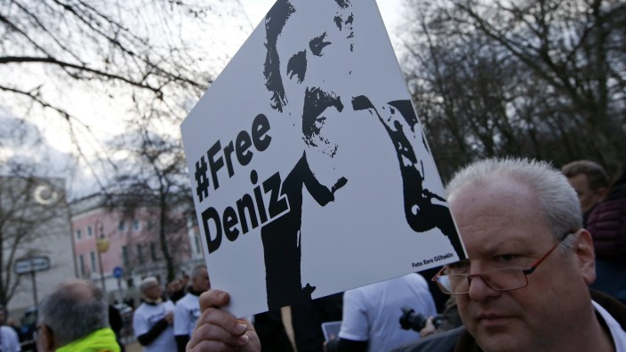Protestors attend a demonstration to support arrested German-Turkish journalist Deniz Yucel