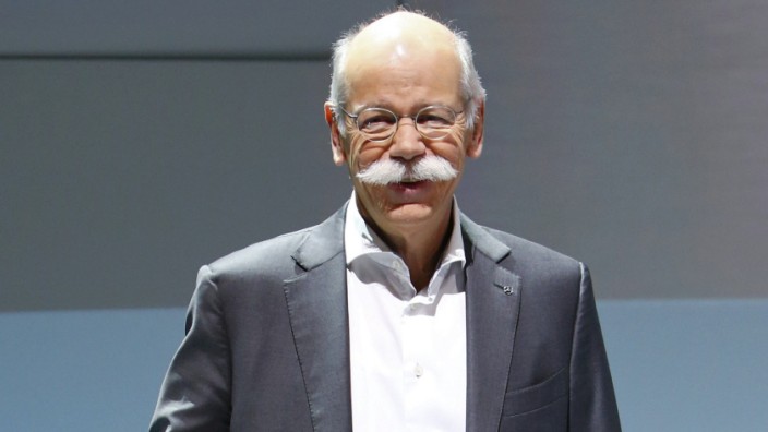 Daimler CEO Zetsche poses for pictures at the car maker's annual news conference in Stuttgart