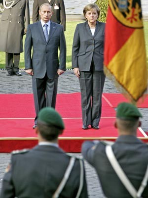 Putin, Merkel, AFP