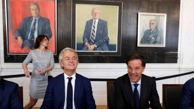 Dutch Prime Minister Rutte of the VVD Liberal party and Dutch far-right politician Wilders of the PVV Party take part in a meeting at the Dutch Parliament after the general election in The Hague