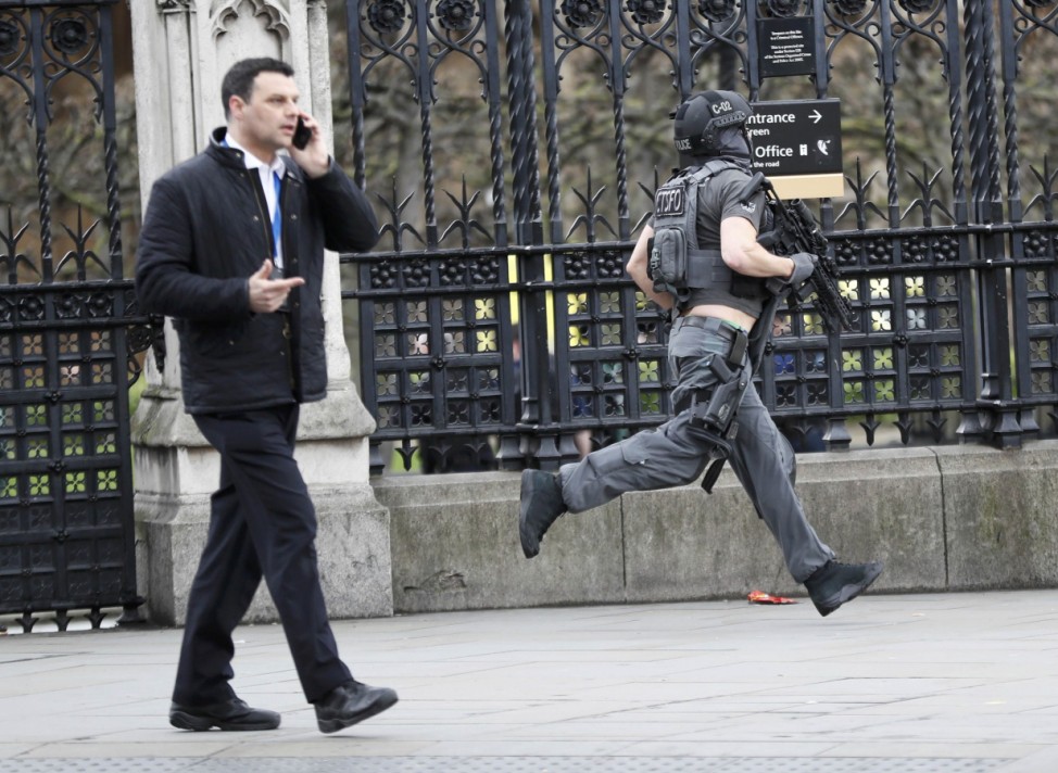 Armed police respond outside Parliament during an incident on Westminster Bridge in London