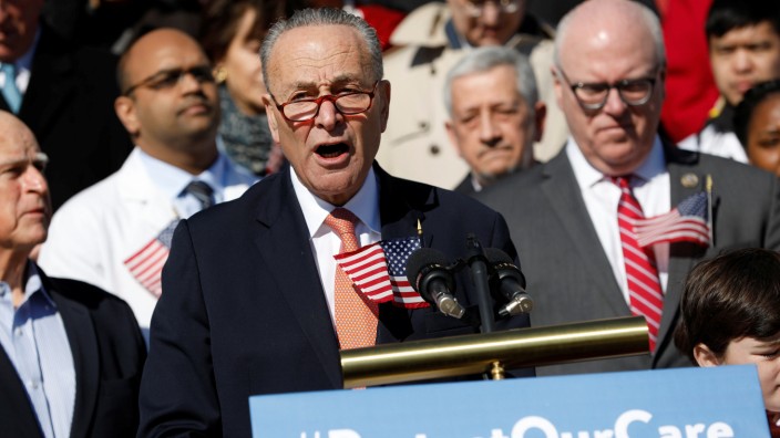 Senate Minority Leader Chuck Schumer speaks at an event marking the seventh anniversary of the passing of the Affordable Care Act outside the Capitol Building in Washington