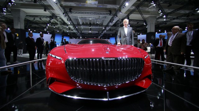 Daimler CEO Zetsche poses near the Mercedes Maybach 6 car before the Daimler annual shareholder meeting in Berlin