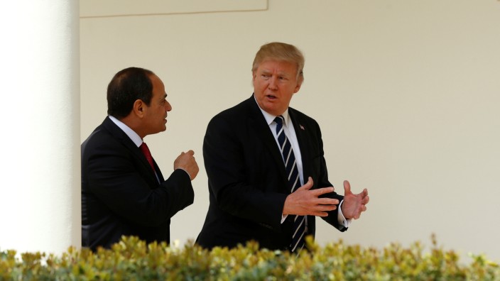 Trump walks with Egypt President Abdel Fattah al-Sisi at the White House in Washington