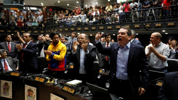 Tomas Guanipa, deputy of the Venezuelan coalition of opposition parties, shouts slogans during a session of the National Assembly in Caracas