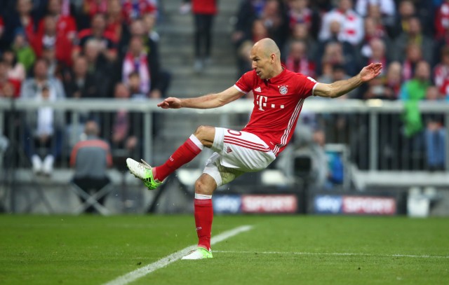 Bayern Munich's Arjen Robben scores their third goal