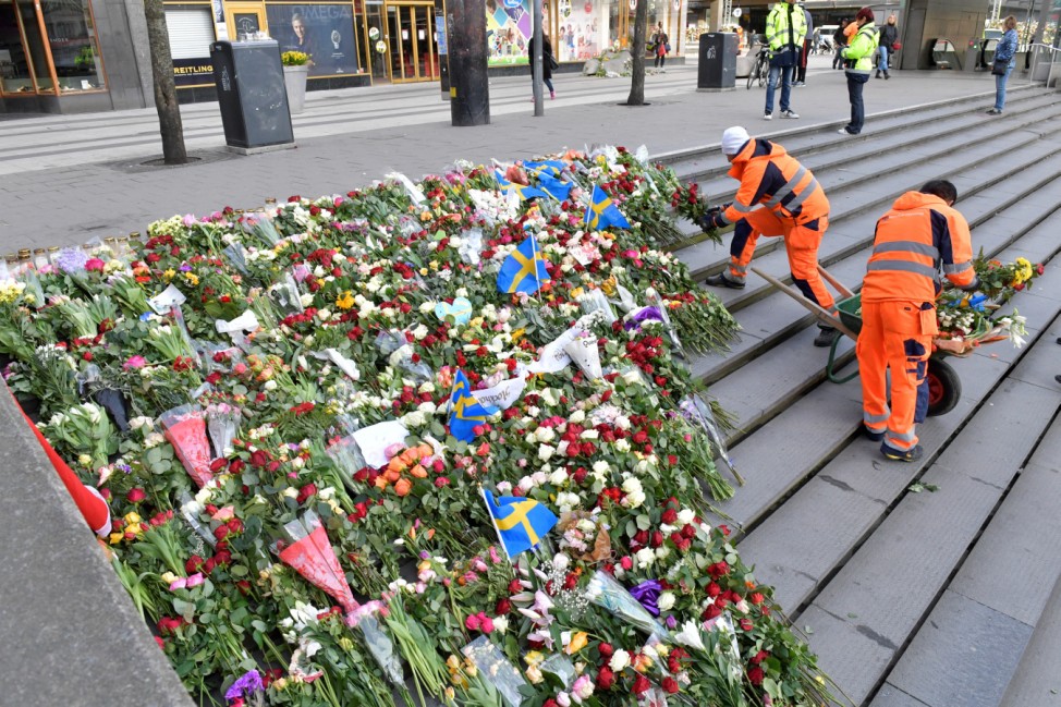 Flowers are placed on the steps at Sergels Torg following Friday's attack in central Stockholm