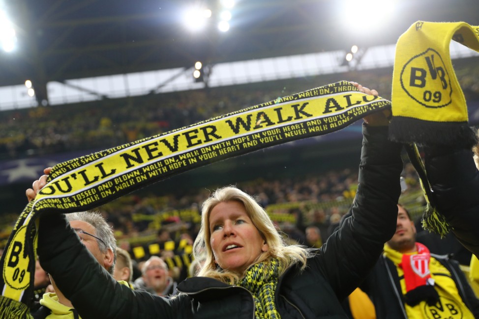 Borussia Dortmund fan holds up a scarf