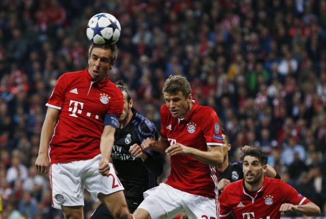 Bayern Munich's Philipp Lahm and Thomas Muller in action