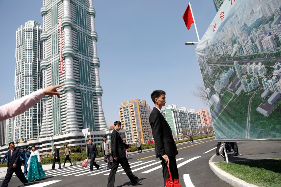 People visit newly constructed residential complex after its opening ceremony in Ryomyong street in Pyongyang