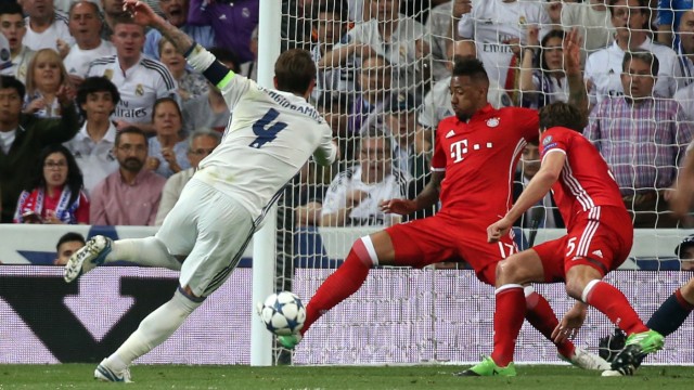 Real Madrid's Sergio Ramos has his shot cleared off the line by Bayern Munich's Jerome Boateng