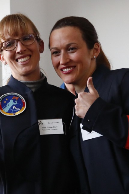 Thiele-Eich and Baumann pose for a picture after being announced by German Economy Minister Zypries as Germany's first female astronauts during a media event in Berlin