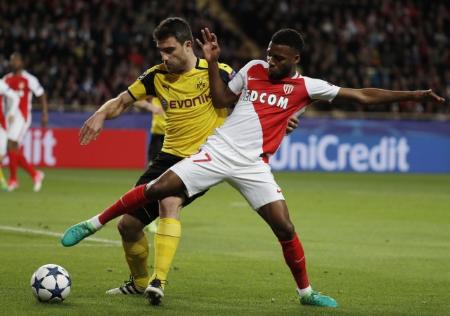 Borussia Dortmund's Sokratis Papastathopoulos in action with Monaco's Thomas Lemar