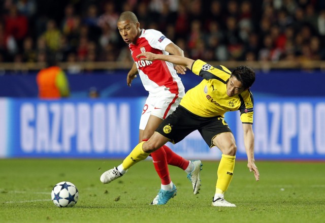 Monaco's Kylian Mbappe-Lottin in action with Borussia Dortmund's Shinji Kagawa