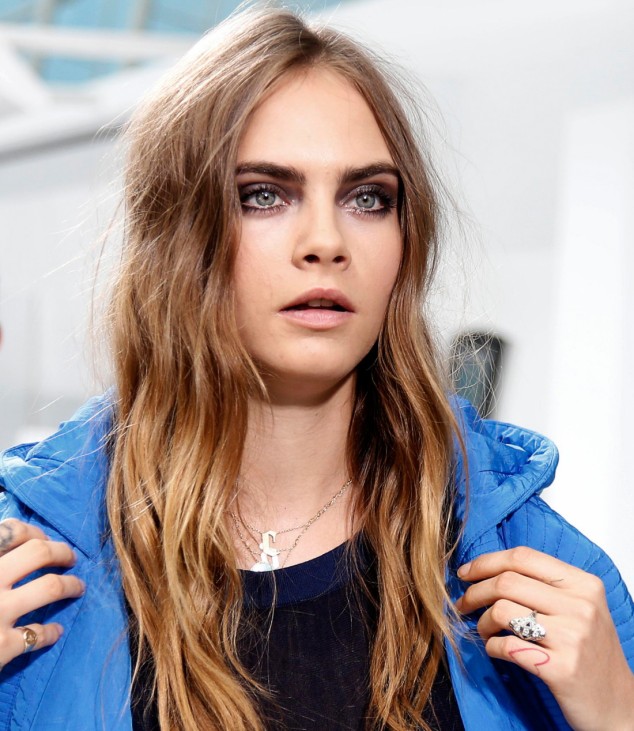 Model Cara Delevingne arrives to attend German designer Karl Lagerfeld's Spring/Summer 2016 women's ready-to-wear collection show for Chanel  in Paris