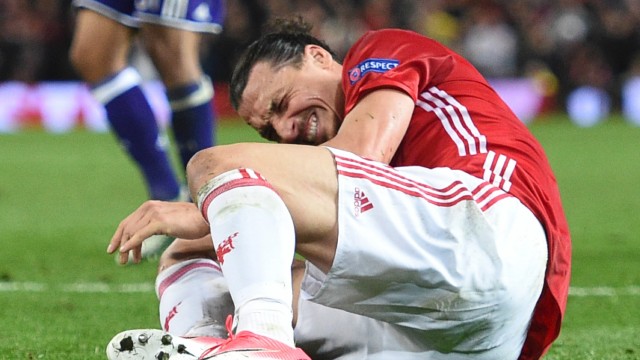 Champions League: Manchester United's Swedish striker Zlatan Ibrahimovic reacts after falling awkwardly during the UEFA Europa League quarter-final second leg football match between Manchester United and Anderlecht at Old Trafford in Manchester, north west England, on April 20, 2017. / AFP PHOTO / Oli SCARFF