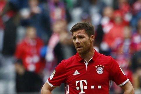 Bayern Munich's Thomas Muller, Xabi Alonso and Thiago Alcantara look dejected after the match