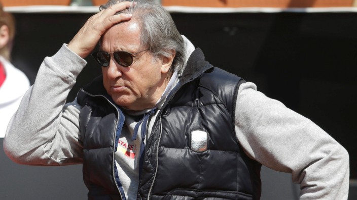 Romania's head coach Ilie Nastase reacts while watching the FedCup Group II play-off match between Romania and Great Britain, in Constanta county