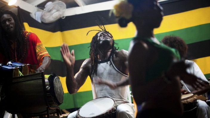 Drummers play to the beat of reggae music in Negril, Jamaica.