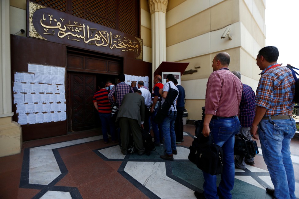 Journalists try to access the main hall where Pope Francis meets Ahmed al-Tayeb, Grand Imam of Egypt's al-Azhar Institution in Cairo
