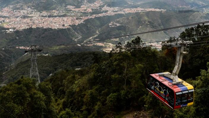 Picture of a cable car of the new Merida cable car system, taken during its reinauguration on April 29, 2016 in the Venezuelan city of Merida. Venezuela reopened on Friday the Merida cable car system called "Mukumbari" -- the longest and highest route in
