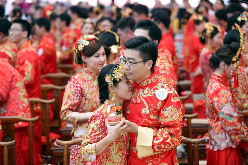 Alibaba employees attend a mass wedding at their headquarters in Hangzhou