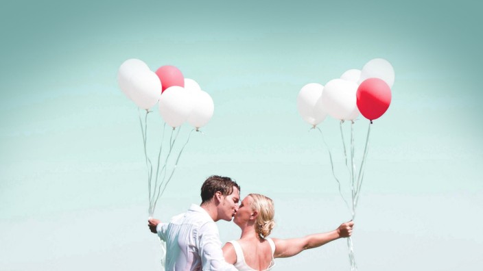 Germany Bavaria Tegernsee Wedding couple standing in lake kissing model released PUBLICATIONxINx