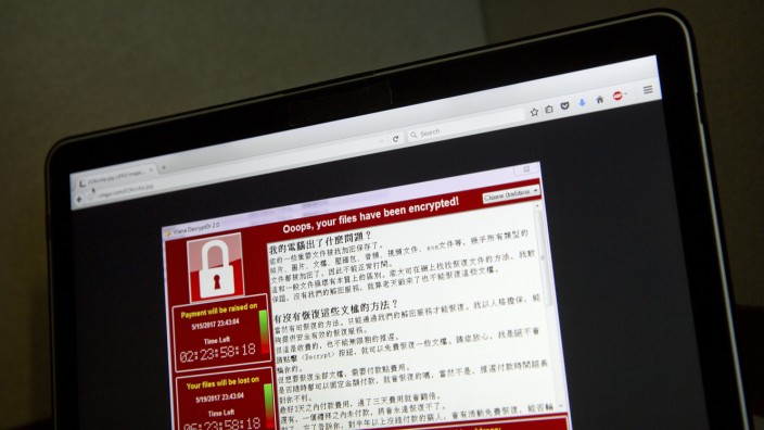 WannaCry: A screenshot of the warning screen from a purported ransomware attack, as captured by a computer user in Taiwan, is seen on laptop in Beijing, Saturday, May 13, 2017. Dozens of countries were hit with a huge cyberextortion attack Friday that locked up computers and held users' files for ransom at a multitude of hospitals, companies and government agencies. (AP Photo/Mark Schiefelbein)
