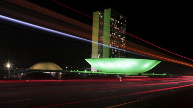 The Brazilian congress is lit up in the colours of the Brazilian national flag ahead of the 2014 World Cup, in Brasilia