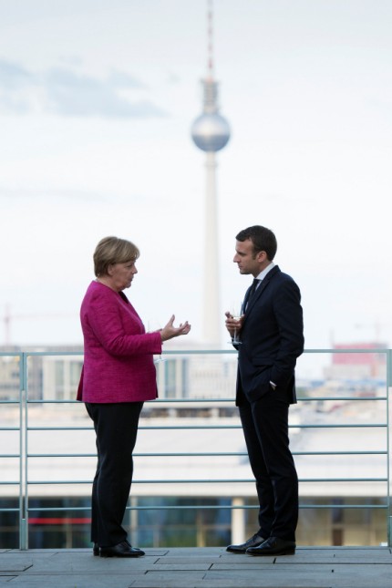 German Chancellor Angela Merkel and French President Emmanuel Macron meet at the Chancellery in Berlin