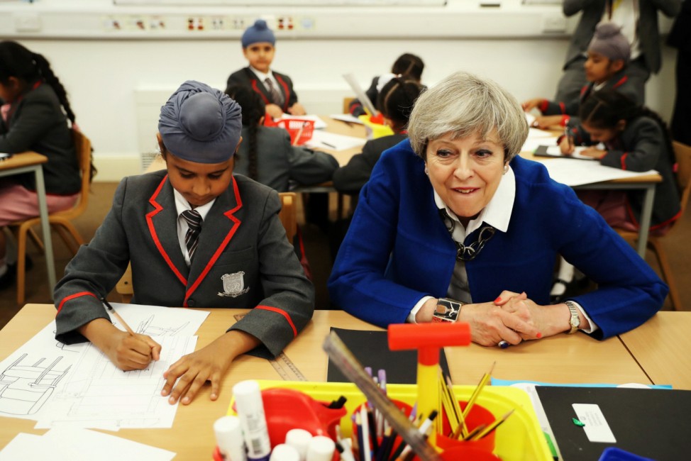 Britain's Prime Minister Theresa May meets the Nishkam Trust leadership team and pupils of Nishkam Primary School in Birmingham