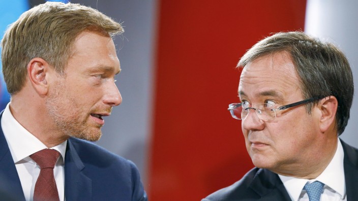 Christian Lindner, chairman of the liberal Free Democratic Party FDP and Armin Laschet, top candidate of the Christian Democratic Union (CDU) during a TV interview in Duesseldorf