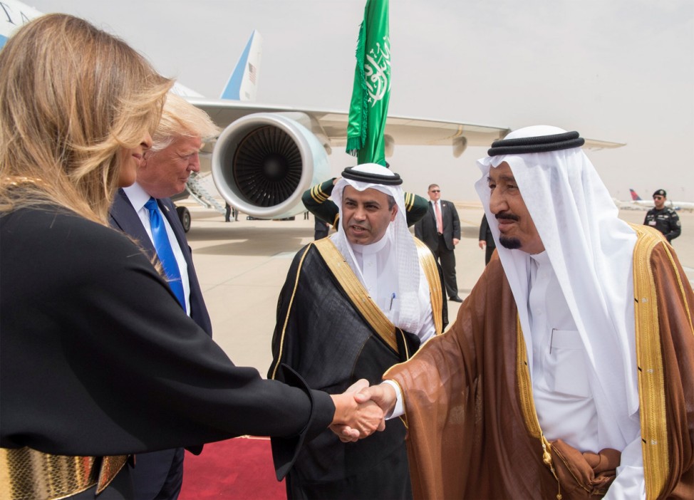 Saudi Arabia's King Salman bin Abdulaziz Al Saud shakes hands with first lady Melania Trump during a reception ceremony in Riyadh
